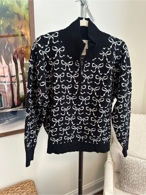 Anthropologie Maeve Black Sweater with White Bow Pattern and Half-Zip Collar